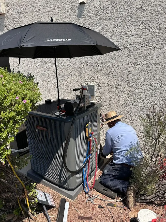 HVAC technician performing outdoor AC maintenance in Palm Bay